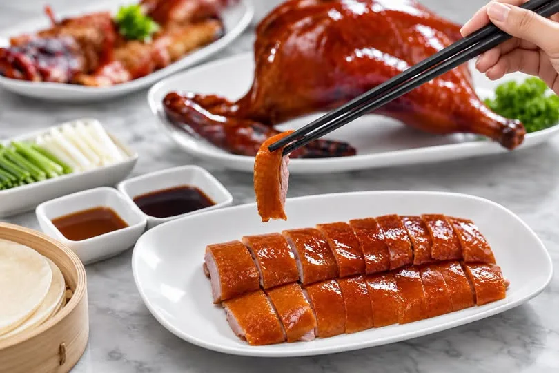 Wu Xing prepares its traditional Peking Duck with…
